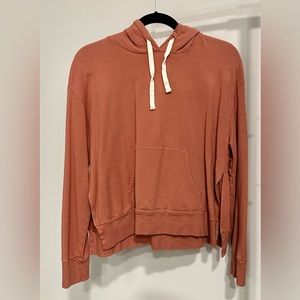 Monrow luxury athleisure hoodie with side cutouts